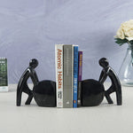 Man Pushing Stone Bookends - set of 2